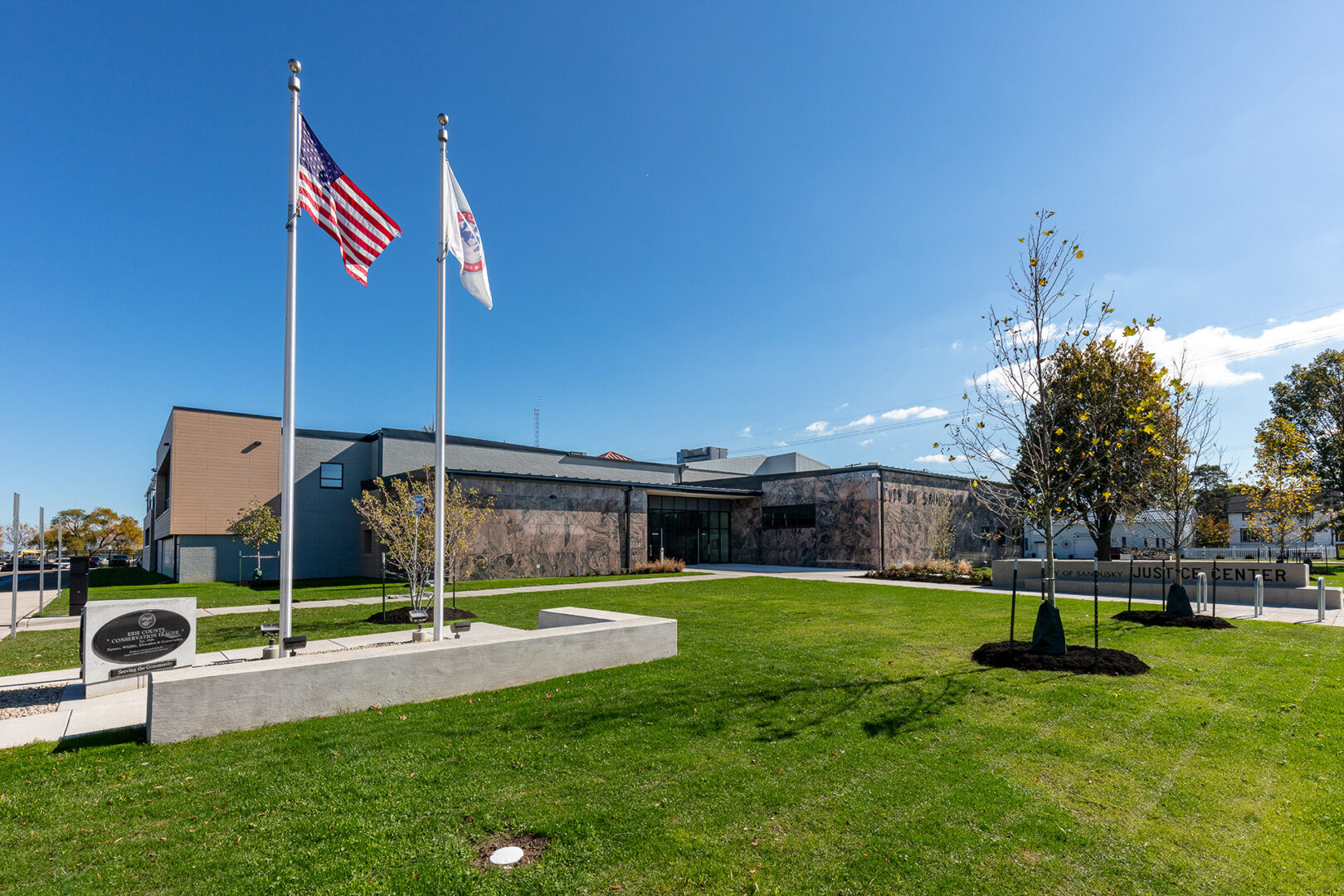 justice center exterior with flagpoles